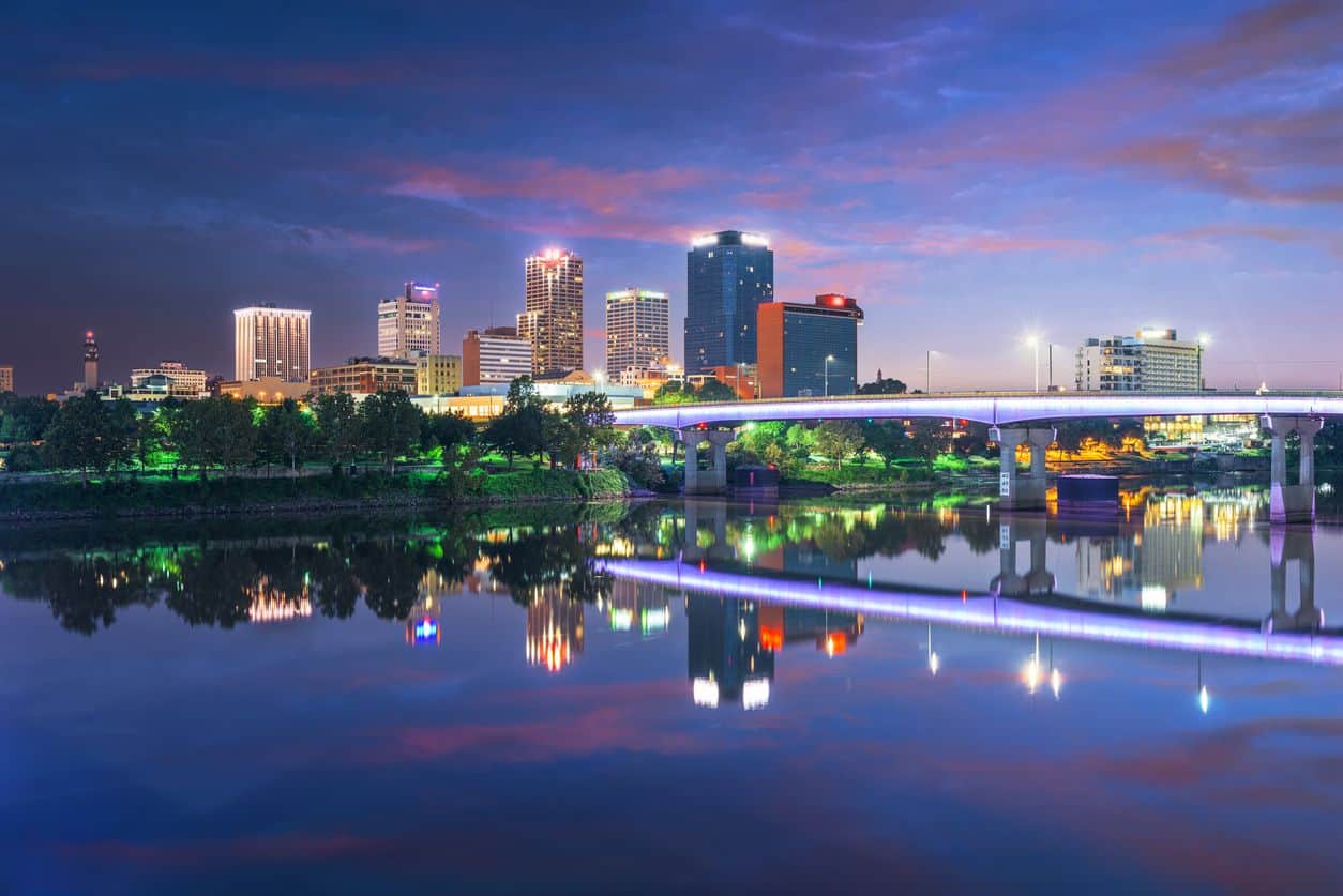 Little Rock, Arkansas, USA skyline on the river at twilight.