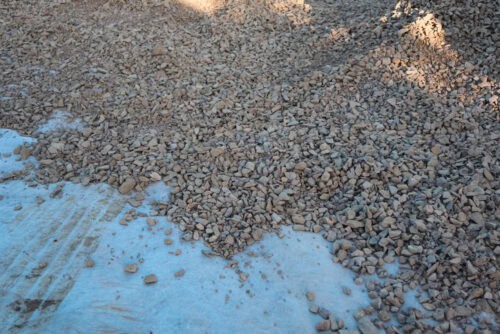 Geotextile layer between gravel on a construction site